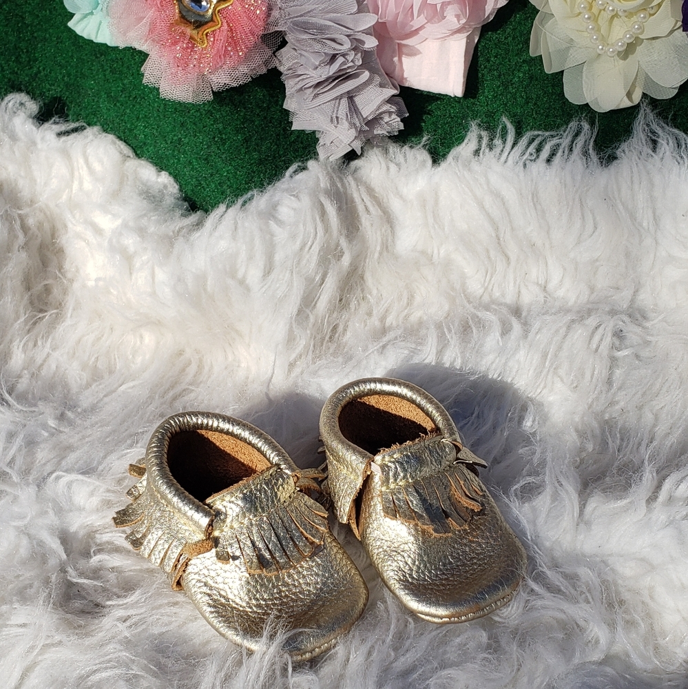 Great fringed gold leather moccasins.